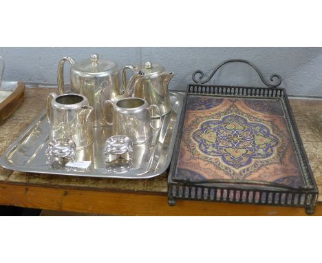 A silver plated tea service and a Middle Eastern style tray 