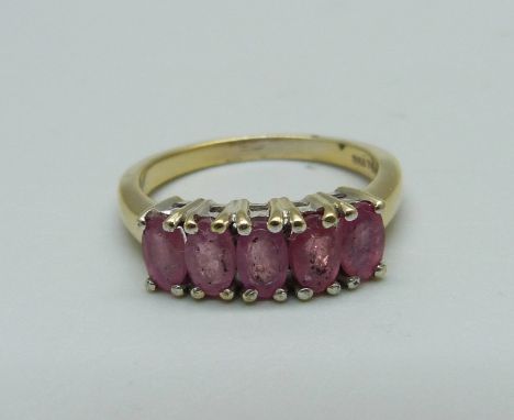 A silver gilt and five red stone ring, L 