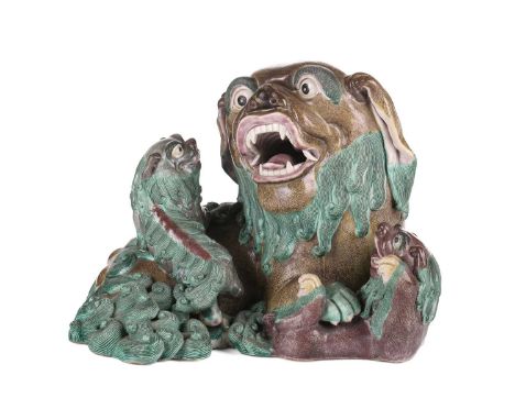 A large Chinese stoneware, Shiwan-type Dog of Foo group, late Qing/ Republic, the recumbent mother and her two playful pups, 