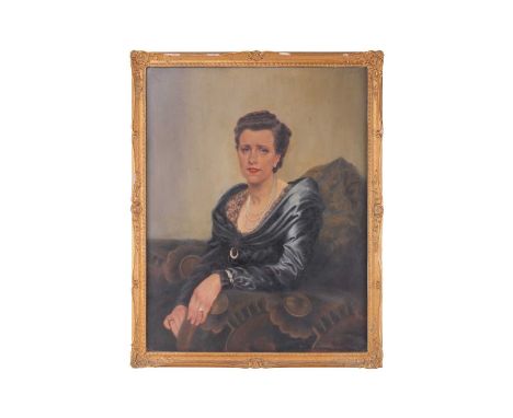 Early 20th-century British school, a half-length portrait of a lady in a blue dress, oil on canvas, 90 cm x 70 cm, glazed in 