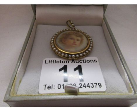 Gold and seed pearl pendant with girl picture
