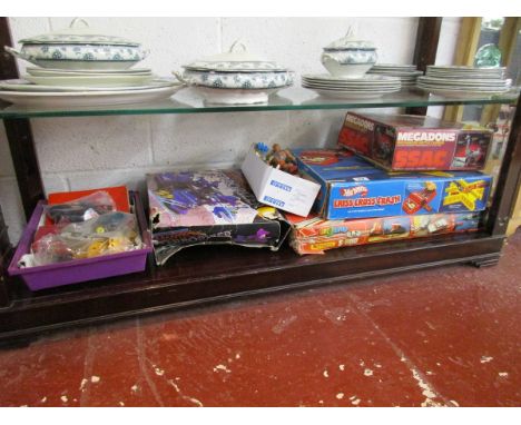 Shelf of retro toys to include Meccano