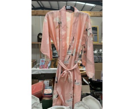 A pink kimono featuring storks. Size R 63, Length 56cm. Made in Japan