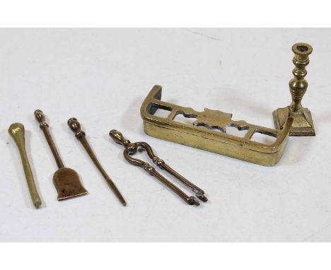 A miniature brass fire fender; together with  miniature fire tongs, poker, shovel, and candlestick etc 