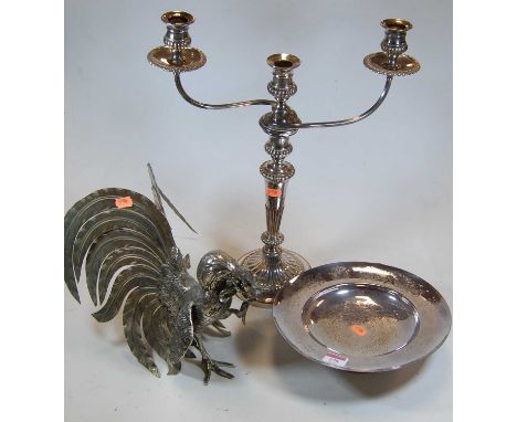 A circa 1900 silver plated three-light candelabrum, h.47cm; together with a modern plated footed bowl; and a metal fighting c