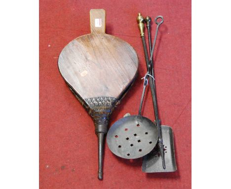 A pair of elm bellows together with a set of cast iron fire tools