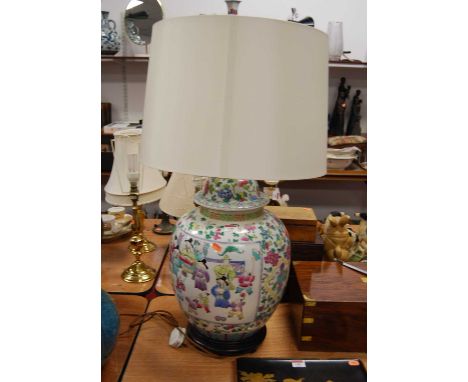 A large 20th Century Chinese famille rose jar and cover, converted into a table lamp, of globular form decorated with figures