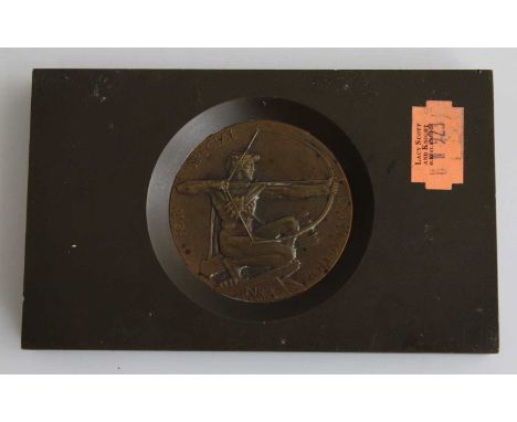 A bronze plaque for The Kings Trophy Competition, fashioned as an inset medallion, the obverse with presentation annotation, 