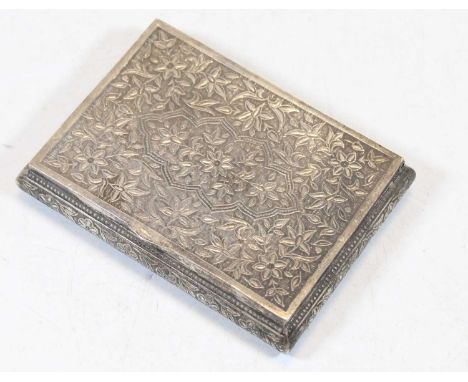 An eastern white metal table snuff box of rectangular bombe form, profusely decorated with scrolling flowers, stamped 925, wi