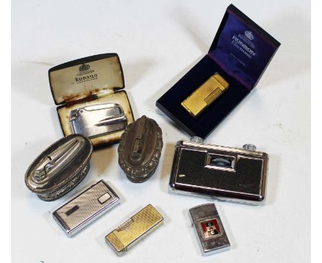 A boxed Ronson Varaflam pocket cigarette lighter; together with various other pocket and table lighters; and a pair of Japane