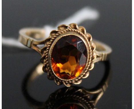 A 9ct gold orange citrine set dress ring, 2.5g, size L/M