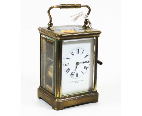 An early 20th century lacquered brass cased carriage clock, having an enamelled dial with Roman numerals, signed Depree Raebu
