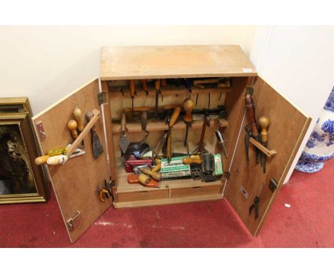 A 20th century plywood tool chest containing mixed tools