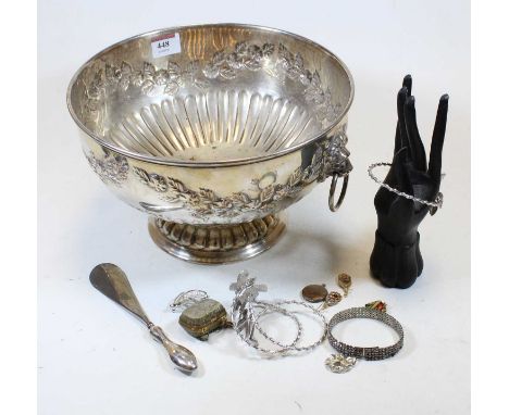 A silver plated punch bowl having a repoussee decoration and lion mask handles, together with a ring tree in the form of a ha