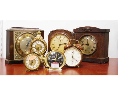 An early 20th century oak cased mantel clock height 19cm, together with six other various mantel and alarm clocks