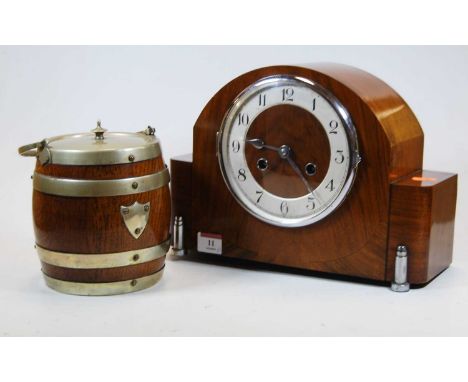 A 1930s walnut cased mantel clock the silvered chapter ring showing Arabic numerals, 8 day movement, height 22cm, together wi