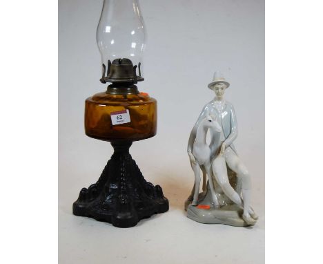 A 20th century Spanish porcelain figure of a seated man beside a foal, height 27cm, together with an early 20th century oil l