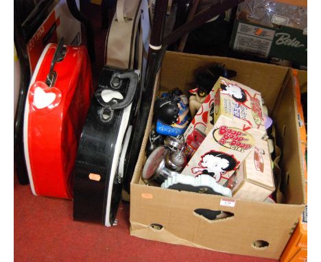 A box of various Betty Boop memorabilia to include an alarm clock, mug, various figures, and three handbags