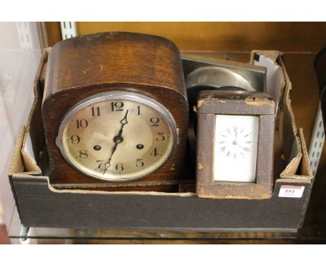 An early 20th century lacquered brass cased carriage clock, having an enamelled dial with Roman numerals and outer Arabic num