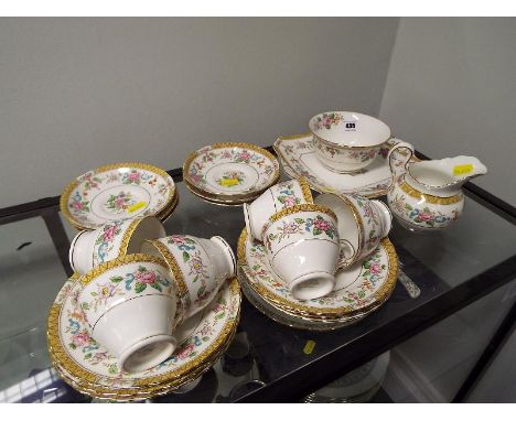 A collection of ceramic tableware by Tuscan, decorated in a floral pattern, comprising approximately 21 pieces (qty)
