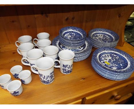 A collection of ceramic blue and white table ware decorated with an Asian pattern, comprising approximately 44 pieces (qty)