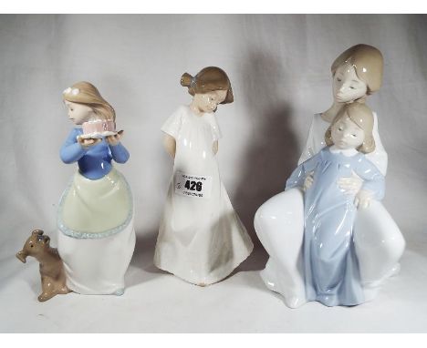 Three Nao by Lladro figures depicting girls, heights vary from 18 cm to 22 cm - Est £25 - £40