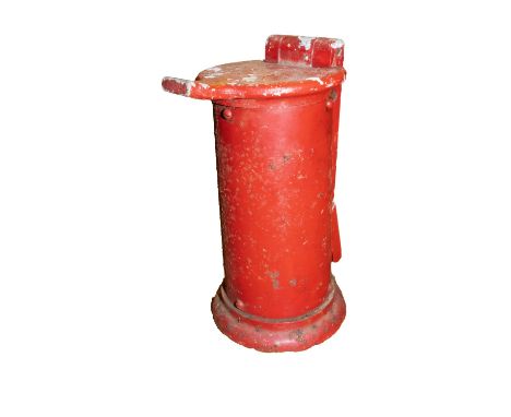 A cast aluminium counter top ticket punch in red (weathered)