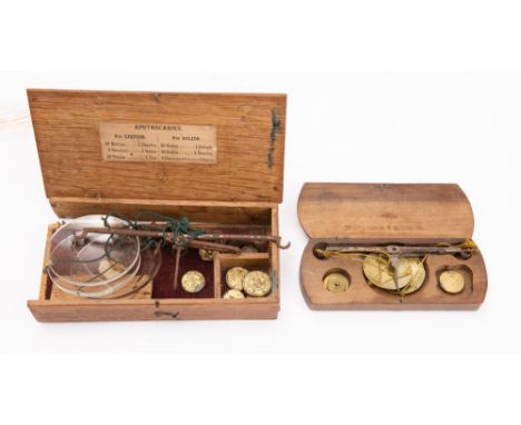 A set of 19th century original cased pocket scales in steel and brass with three graduated weights; also oak cased apothecari