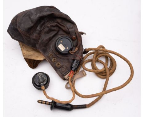 A WWII RAF Type C leather flying helmet, fitted black Bakelite headphones stamped with broad arrow and numbered '10A/13466' w