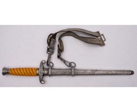 A German Army dagger, maker SMF Solingen, the straight double edge blade with maker's mark as per title, over  hilt with scro