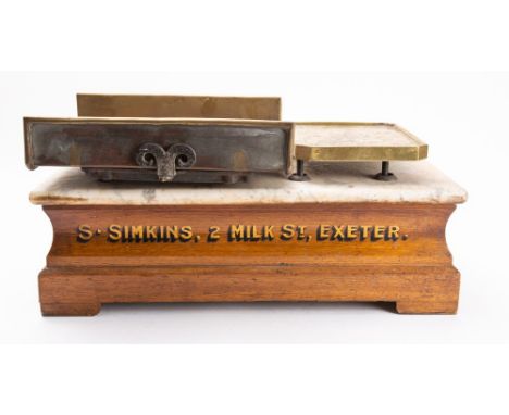 A set of  'The 'Crown'  counter top scales for 'S.Simkins, 2 Milk St, Exeter'. original marble top over oak base with two bra