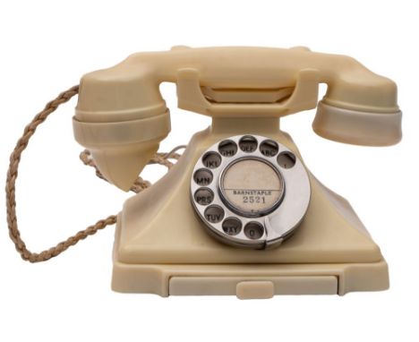 A GPO series 332 Ivory telephone with rotary dial and pull out tray, stamped '1/232L' and 'S58/2' to underside.