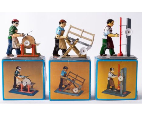 A boxed group of three Wilseco tinplate workmen, comprising M74 'Shears Grinder' M75 'Press Operator' and  M76 'Carpenter' ( 