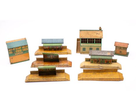 An unboxed group of Hornby O gauge  platforms and signal boxes, all with lithograph printed decoration. 