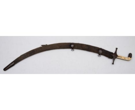 An early 19th-century Indian Shamishir, the curved single-edged blade with gold inlaid maker's mark above steel hilt and two-