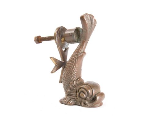 A small brass dolphin door knocker by Cutajar Works, Malta,  stamped as per title, 10.5cm high.  