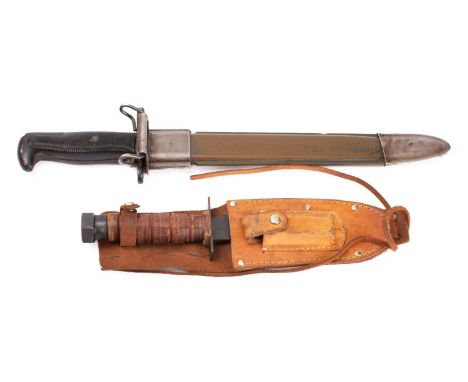 A US Garrand bayonet,  the straight single edge fullered blade stamped 'ENS E-US' with grenade motif, two piece black ribbed 