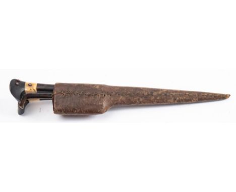 A late 19th century Indo-Persian Pesh Kabz, the traditional shaped blade with brass hilt, signed to the top and decorated wit