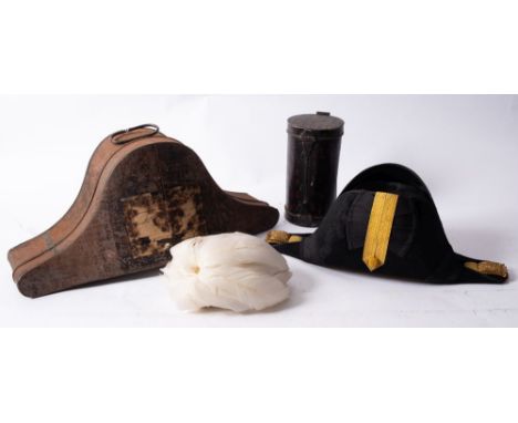 A late 19th /early 20th century black felt bicorn hat, with gold braid satin trunk, remains of label to exterior . 'Col....Ar