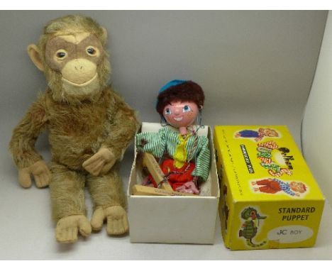 A Pelham puppet, JC Boy, boxed and a Chilton soft toy monkey