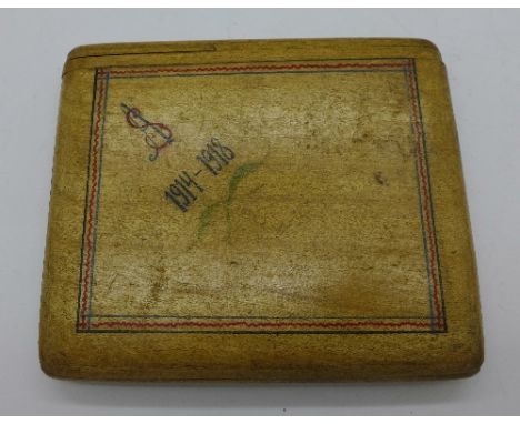 A wooden cigarette case with 1914-1918 inscription with secret opening