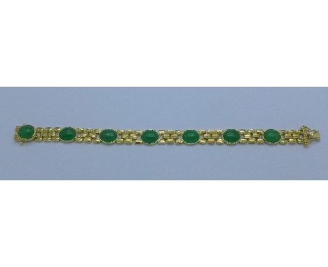 A silver gilt and jade bracelet