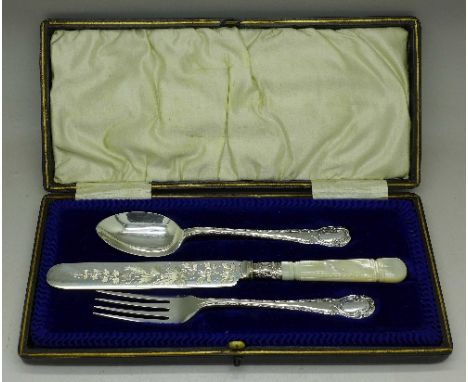 A cased knife, fork and spoon, knife with 1904 silver ferrule
