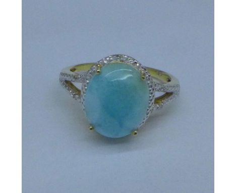 A silver gilt ring set with larimar and diamonds, R