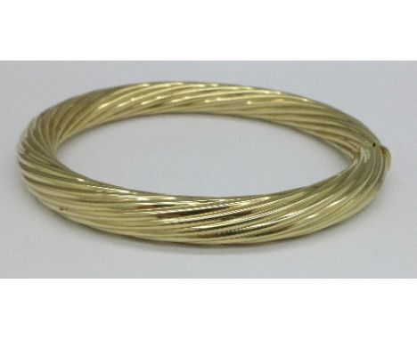 A 9ct gold bangle, 19.6g