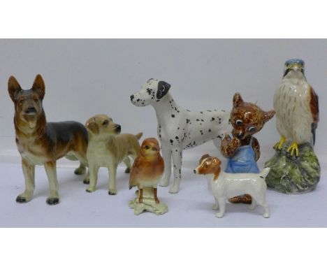 A Whyte & Mackay kestrel decanter, a West German Alsatian, a/f, a bear marked KT216 on base, a Beswick Jack Russell, Beswick 