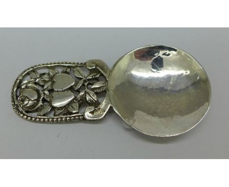 A modern silver Art and Crafts style caddy spoon