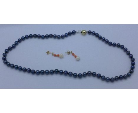 A string of black pearls with 9ct gold clasp and a pair of 9ct gold mounted coral and pearl earrings
