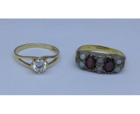 Two silver gilt rings; one set with garnet and opal, L and M