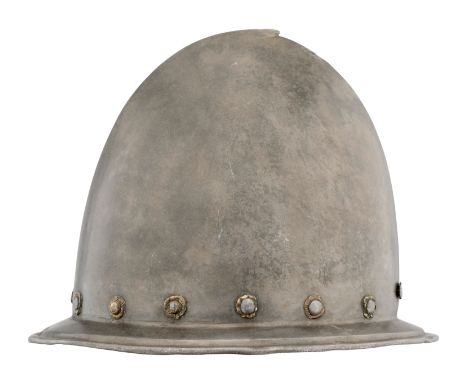 AN ITALIAN MORION IN THE ~SPANISH~ FASHION, CIRCA 1580formed in one piece with an almond-shaped crown rising to a short ~stal